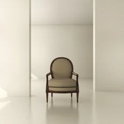 Classic upholstered armchair with wooden frame in a minimal, modern interior setting